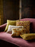 Close up of Fromental Cushions in multiple patterns and colours